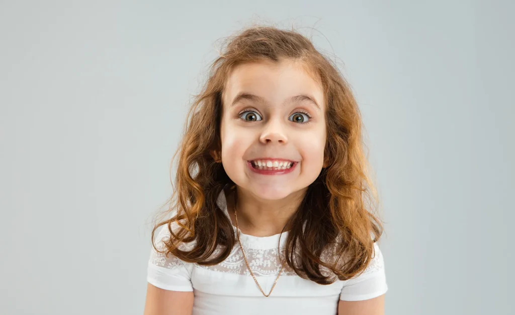 Girl Smiling After Dental Treatment