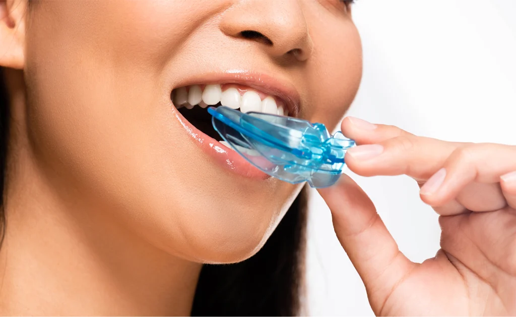 Women Wearing Dental Mouth Guard In Northville, MI